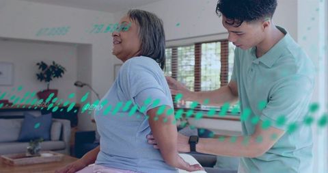 Caregiver assisting senior with posture correction and ar health overlay for home care