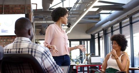 Diverse team brainstorming ideas in modern startup office