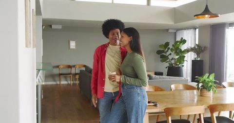 Romantic couple enjoying coffee in cozy modern interior