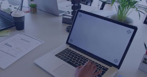 Modern Office Workspace with Laptop and Coffee