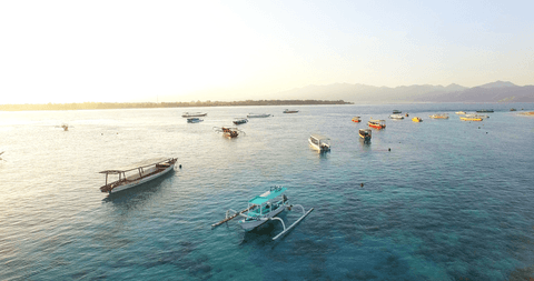aerial view of boats on lake with clear sky at sunset - Download Free Stock Videos Pikwizard.com