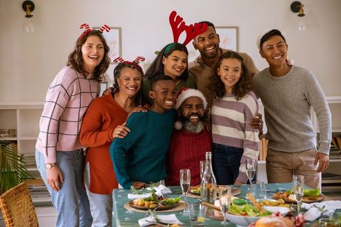 Diverse Family Celebrating Christmas with Joy and Togetherness around Table