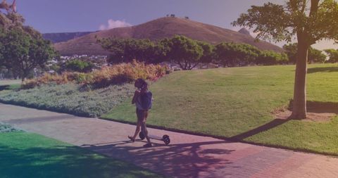 Young Woman Walking Urban Park with Electric Scooter - Download Free Stock Images Pikwizard.com