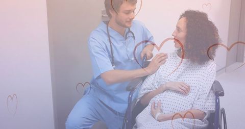 Doctor Assisting Pregnant Biracial Woman in Hospital