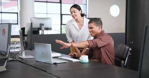 Successful Business Team High Fiving in Modern Office