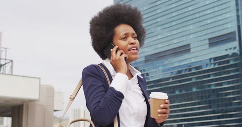 Businesswoman Engaged in City Commute Call