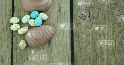 Displaying chocolate eggs and pastel speckled candies on rustic wood with social icons