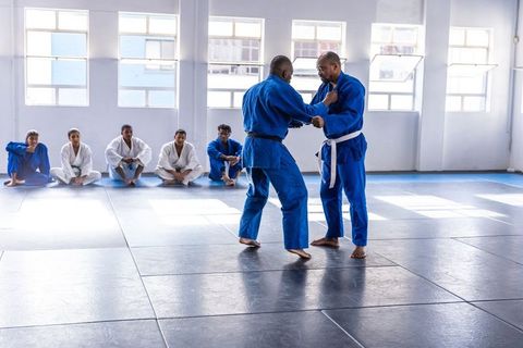 Jiu-jitsu training session with instructor demonstrating techniques