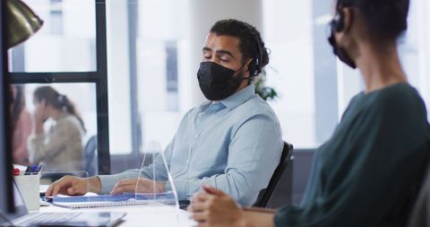 Office Workers with Masks Discussing Project at Workstations - Download Free Stock Images Pikwizard.com