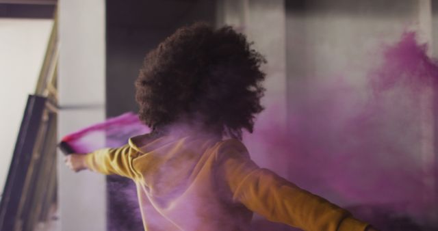 Young person playing with purple powder outdoors - Download Free Stock Images Pikwizard.com