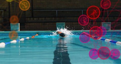 Male swimmer performing powerful backstroke in outdoor lane with splash and reflections
