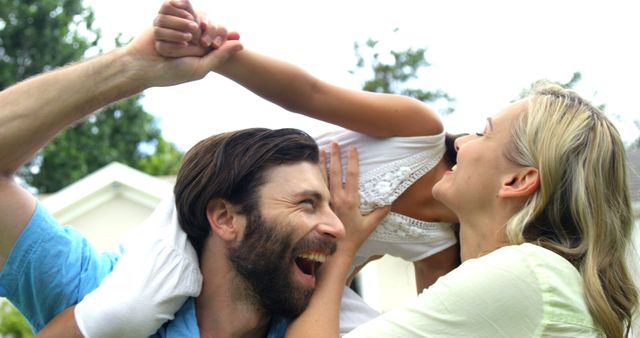 Happy Family Enjoying Playful Moment Outdoors - Download Free Stock Images Pikwizard.com