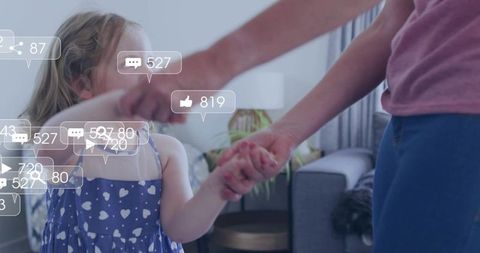 Mother holding hands with daughter wearing heart dress, social media likes and comments overlay