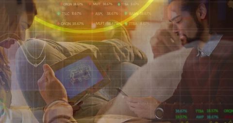 Collaborating team reviewing tablet and smartphone with data overlays in casual lounge