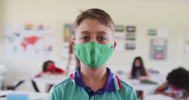Boy Wearing Green Face Mask in Classroom During School Day - Download Free Stock Images Pikwizard.com