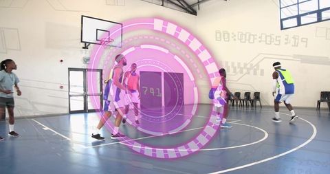 Players dribbling and defending on indoor basketball court with futuristic hud overlay