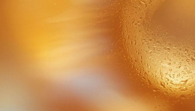 Ethereal Abstract Amber Glass Texture with Water Droplets