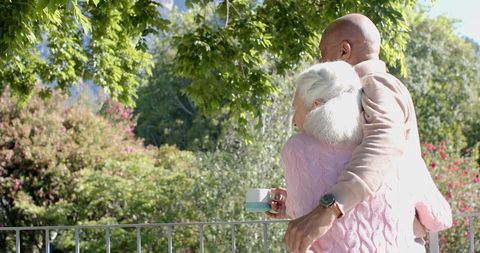 Senior Couple Enjoying Scenic View on Balcony