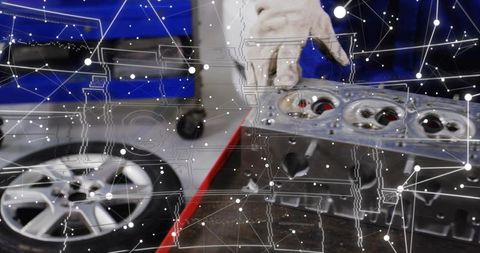 Gloved technician lifting cylinder head, ar overlay scanning engine components in workshop