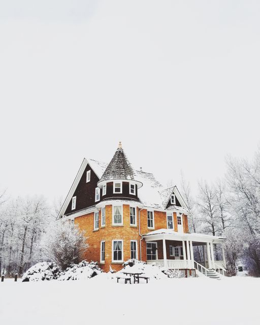 Snow-Covered Victorian House in Winter Landscape - Download Free Stock Photos Pikwizard.com