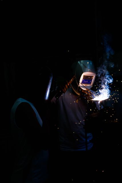 Industrial Welder Working with Protective Helmet and Gear - Download Free Stock Images Pikwizard.com