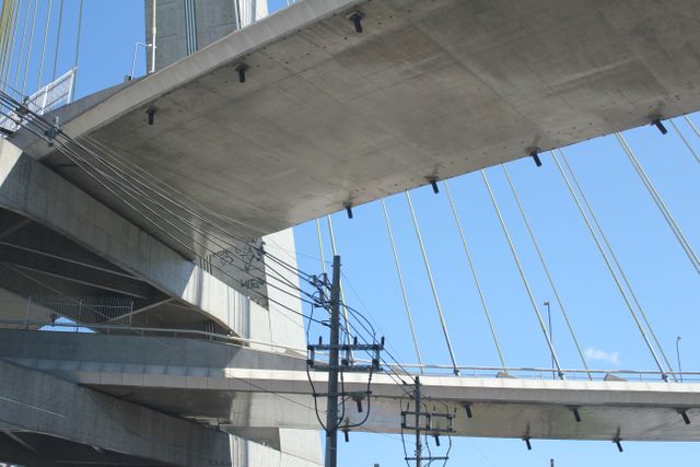Modern Concrete Cable-Stayed Bridge Structure with Clear Sky - Download Free Stock Images Pikwizard.com