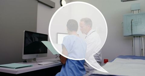 Healthcare Professionals Discussing Patient Data on Computer