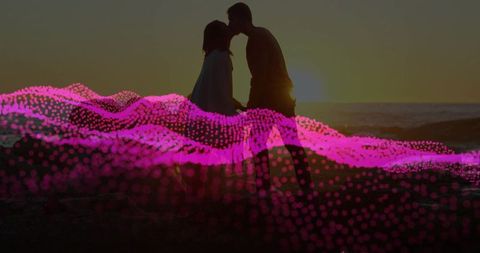 Romantic Couple Silhouette at Sunset Beach with Abstract Pink Waves