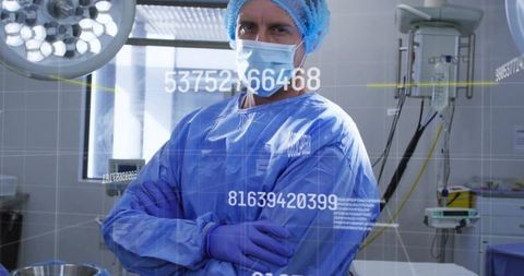 Surgeon standing arms-crossed wearing surgical gown and mask with digital hud overlay