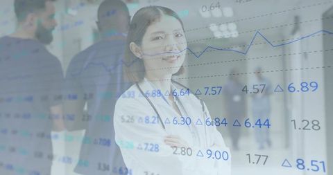 Female doctor leading healthcare analytics with blue data overlay in hospital corridor