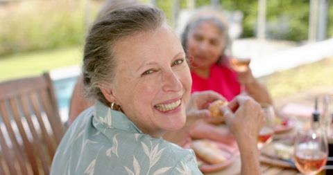 Joyful Senior Friends Dining Al Fresco with Laughter - Download Free Stock Images Pikwizard.com