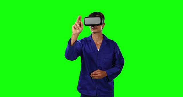 Engineer in blue overalls exploring virtual reality with VR headset. Image is ideal for technology, innovation, and future-tech concepts. Can be used for promotional materials, tech tutorials, and engineering-focused content.