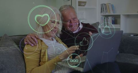 Senior Couple Using Laptop with Social Media Interface Overlay