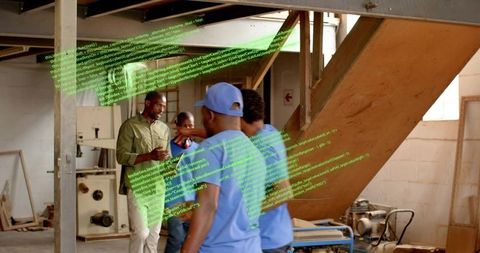 Supervising workshop team operating table saw with holographic code overlay