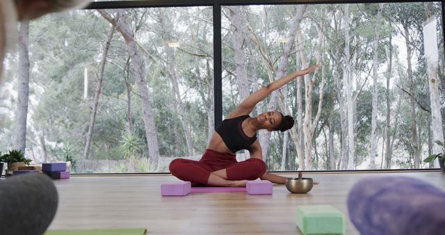 Woman Practicing Yoga Indoors with Large Window View - Download Free Stock Images Pikwizard.com