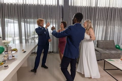 Elegant Wedding Celebration with Friends Toasting in Stylish Lounge