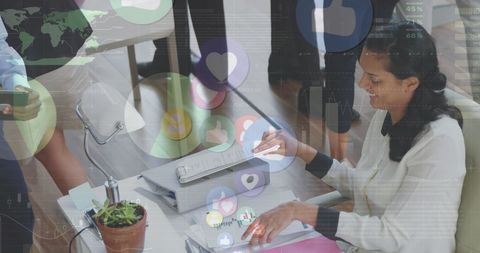 Businesswoman analyzing data with digital social media icons