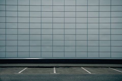 Modern Minimalist Exterior Wall with Empty Parking Spaces
