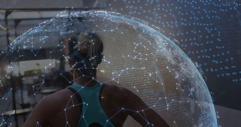 Female Athlete Standing in Gym Watching Holographic Globe, Futuristic Fitness Network