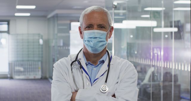 Experienced Male Doctor Wearing Mask in Modern Hospital - Download Free Stock Images Pikwizard.com