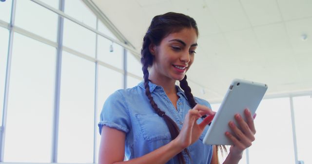 Smiling Woman with Tablet in Bright Modern Office - Download Free Stock Images Pikwizard.com