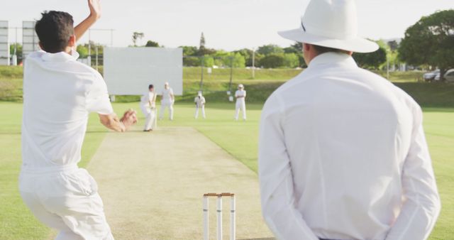 Bowler in Action During Cricket Match with Umpire Watching - Download Free Stock Images Pikwizard.com