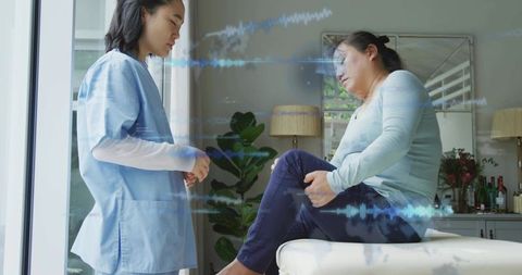 Home care nurse assessing knee pain with waveform overlay for telehealth diagnostics