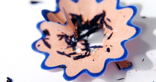 Detailed Close-Up of Blue Pencil Shavings on White Background - Download Free Stock Images Pikwizard.com