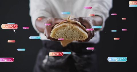 Baker presenting artisan bread with digital tags highlighting modern technology