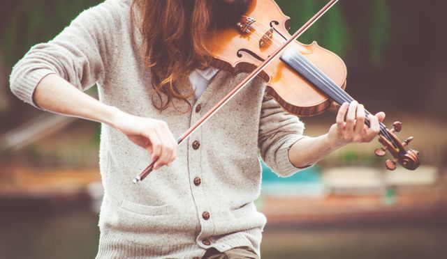 Young Musician Playing Violin Outdoors in Sweater - Download Free Stock Photos Pikwizard.com