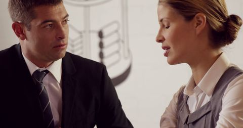 Business professionals engaged in work discussion