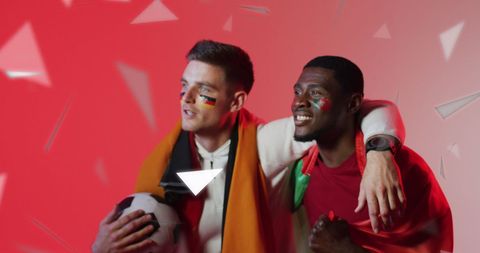 Diverse Football Fans with German and Portuguese Flags Celebrating
