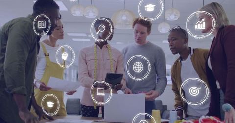 Creative team collaborating in modern workspace with digital overlays