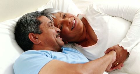 Senior Couple Sharing a Joyful Moment in Bed